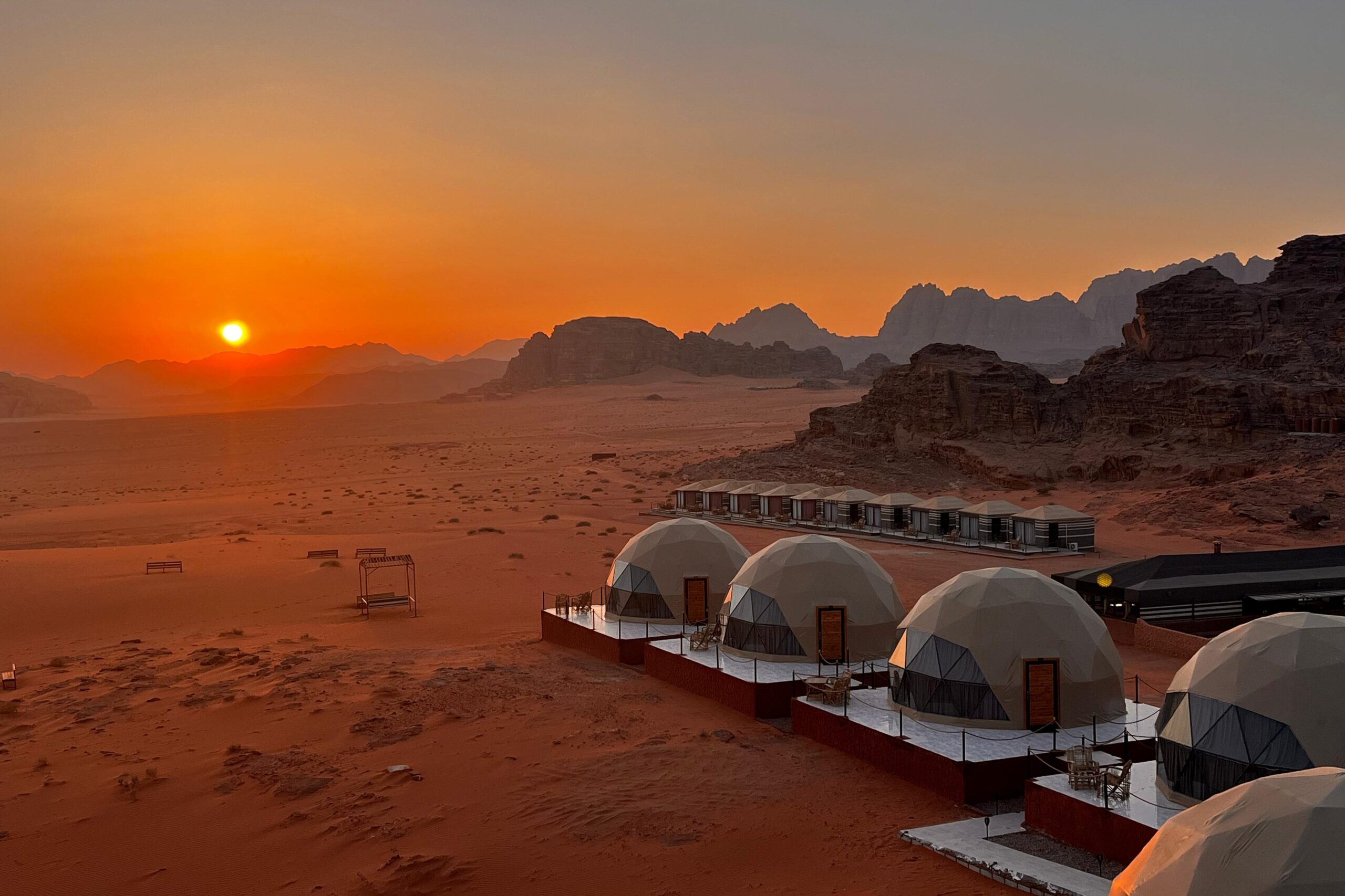 Aerial view of the Luxury Bubble Tents in Wadi Rum desert at sunset