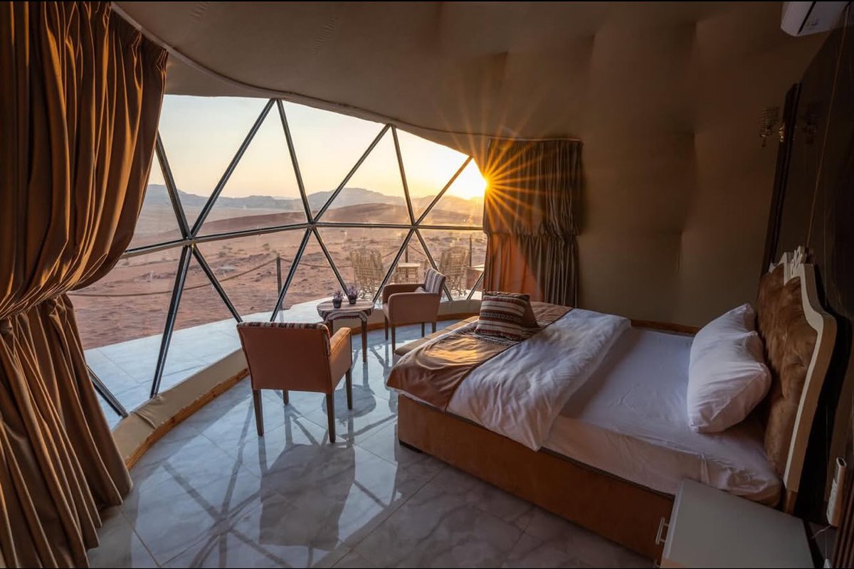 Inside the Luxury Bubble Tent at sunset with panoramic window, Wadi Rum