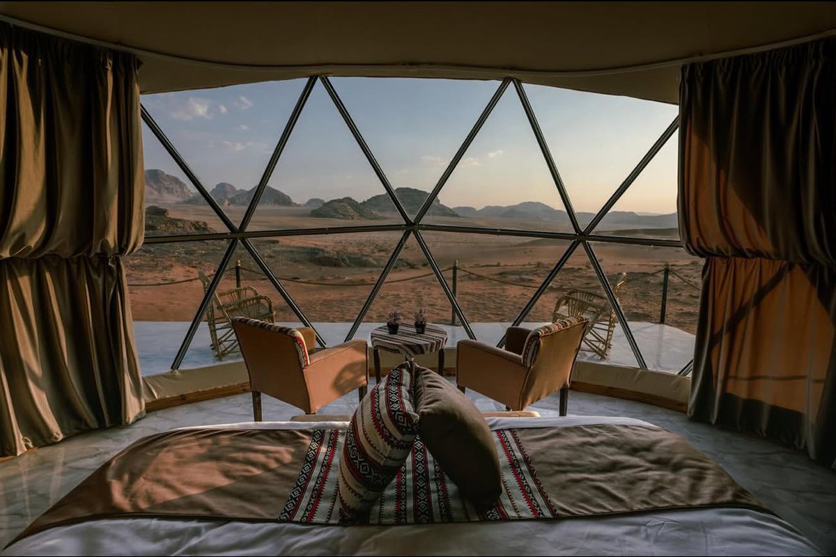 Desert view from the bed through the panoramic window of the Bubble Tent